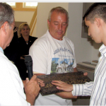 Men examining counter top material