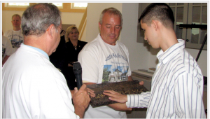 Men examining counter top material