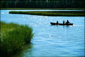 Father and Sons In Canoe